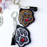 White dog paw on black Embroidery Kit: DIY Keychain, Leatherette Base